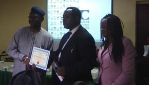Chief Medical Director LASUTH receives the HEWAN certificate of recognition from immediate paste president of HEWAN, Azoma Chikwe watched by HEWAN President Chioma Obinna.